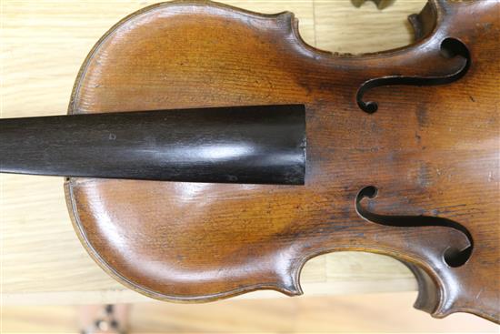 A violin, bow and a mother of pearl inlaid mandolin